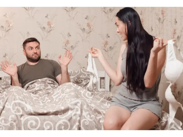 couple unhappy in bed